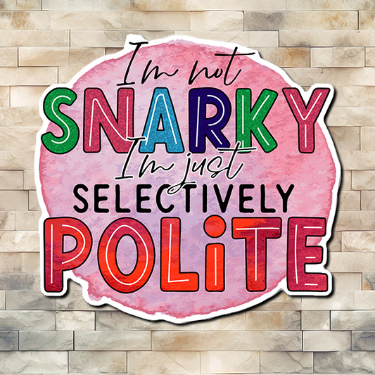 An image with a pink circular blob in the middle and over it are the words "I'm Not Snarky I'm Just Selectively Polite". Vinyl Sticker